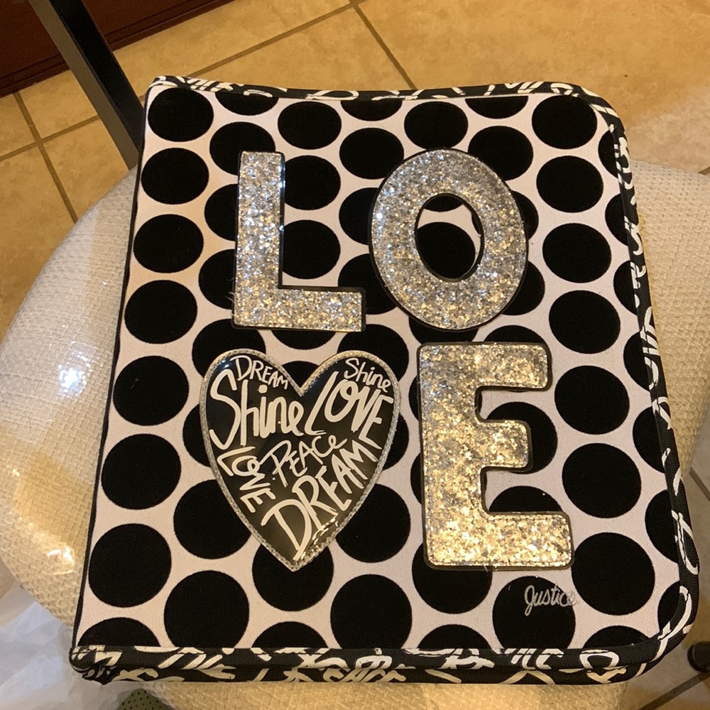 Justice brand binder with LOVE‎ black dots.